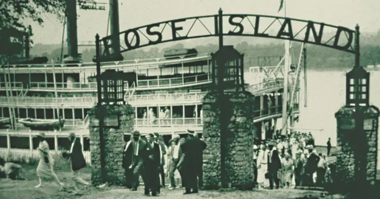 Visitors arriving at the Rose Island entrance arch